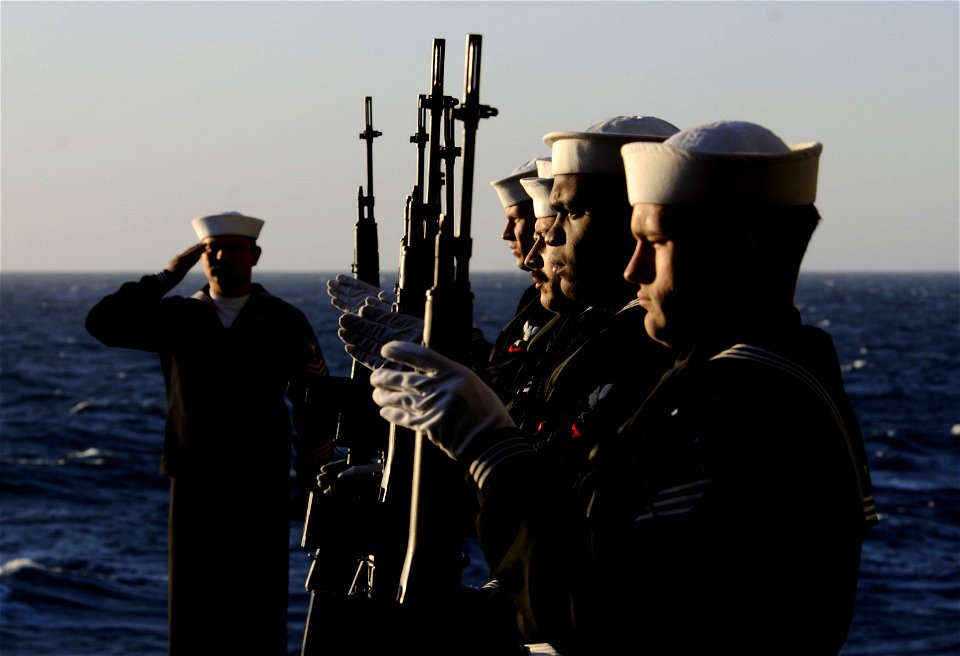 US Navy 111201-N-GZ277-407 The rifle detail aboard the Nimitz-class aircraft carrier USS Carl Vinson (CVN 70) presents arms during a burial at sea