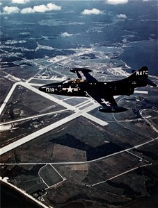 Grumman F9F-2 Panther in flight over Naval Air Station Patuxent River, in the 1950s (NH 101804-KN)