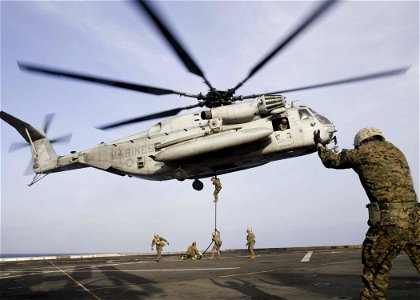 Marines practice fast-roping from a CH-53E. (8243541045)