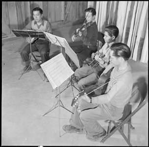 Jerome Relocation Center, Denson, Arkansas. A self organized string quartet, or more accurately, a . . . - NARA - 539357 photo