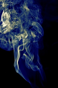 White and blue smoke on black photo