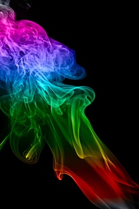 Multi color smoke on black background