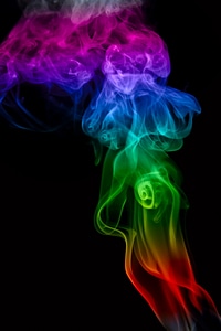 Multicolored smoke on black background photo