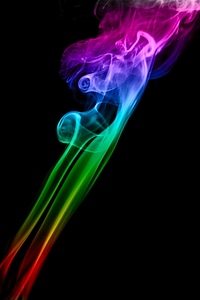 Smooth multicolored smoke on black photo