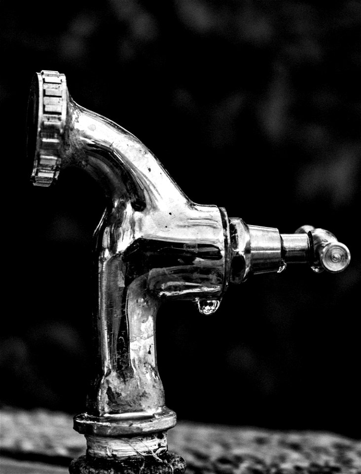 Grayscale Photo Of Stainless Steel Faucet