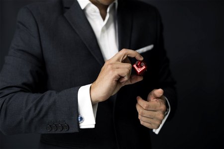 Man Holding Red Cube photo