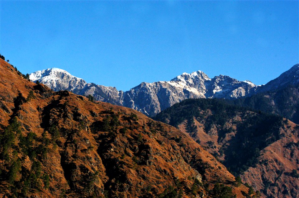 Brown Mountain With Snow Caps