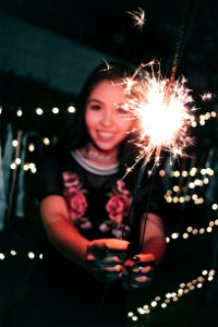 Woman Holding Firecrackers photo