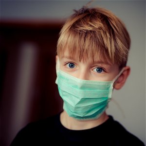 Boy Wearing Surgical Mask photo