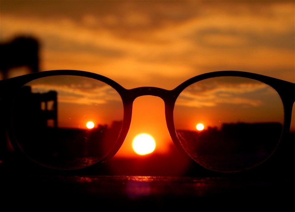 Close-up Photography Of Eyeglasses At Golden Hour