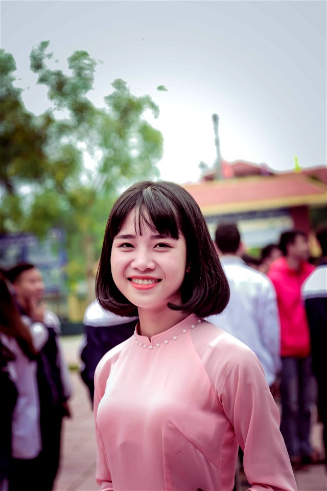Photography Of A Woman In Pink Long-sleeved Top Smiling