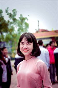 Photography Of A Woman In Pink Long-sleeved Top Smiling photo