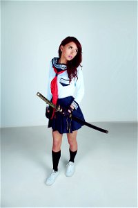 Woman Wearing School Uniform Samurai Outlook Carrying Katana photo