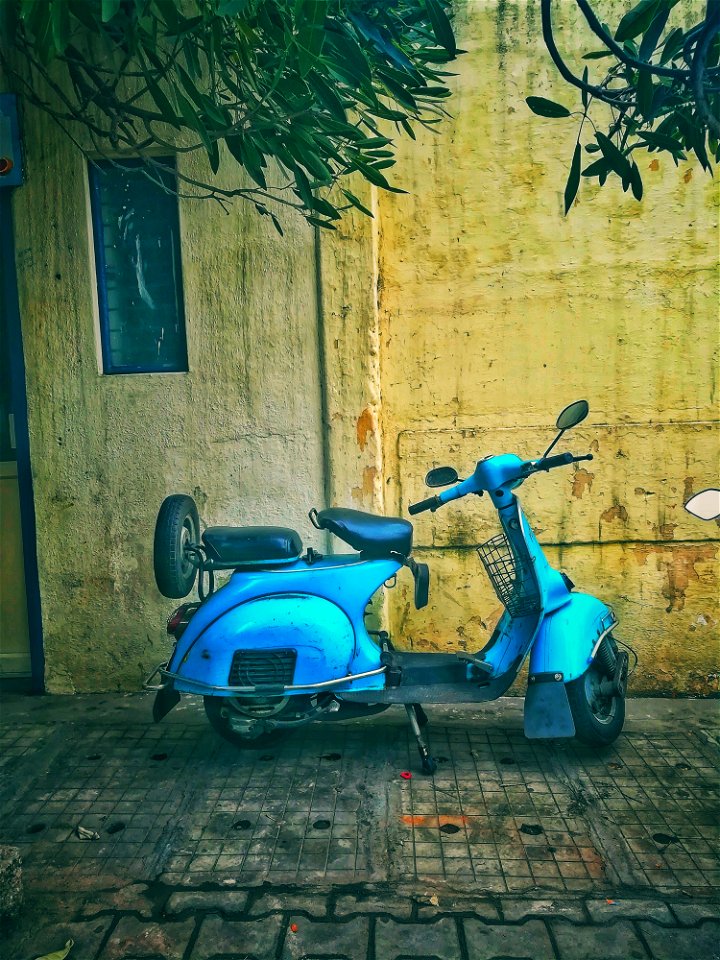 Teal Motor Scooter On Road