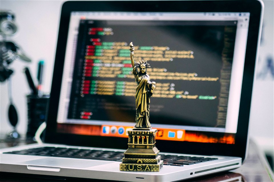 Statue Of Liberty Miniature On Macbook Pro