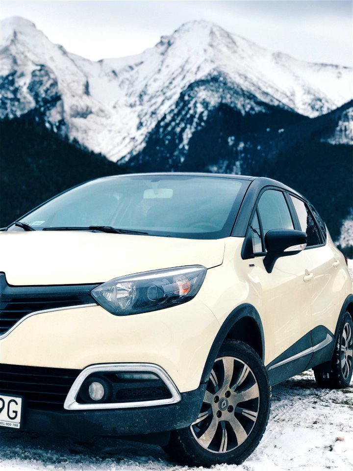 White Renault Clio 4 On Snow Covered Road