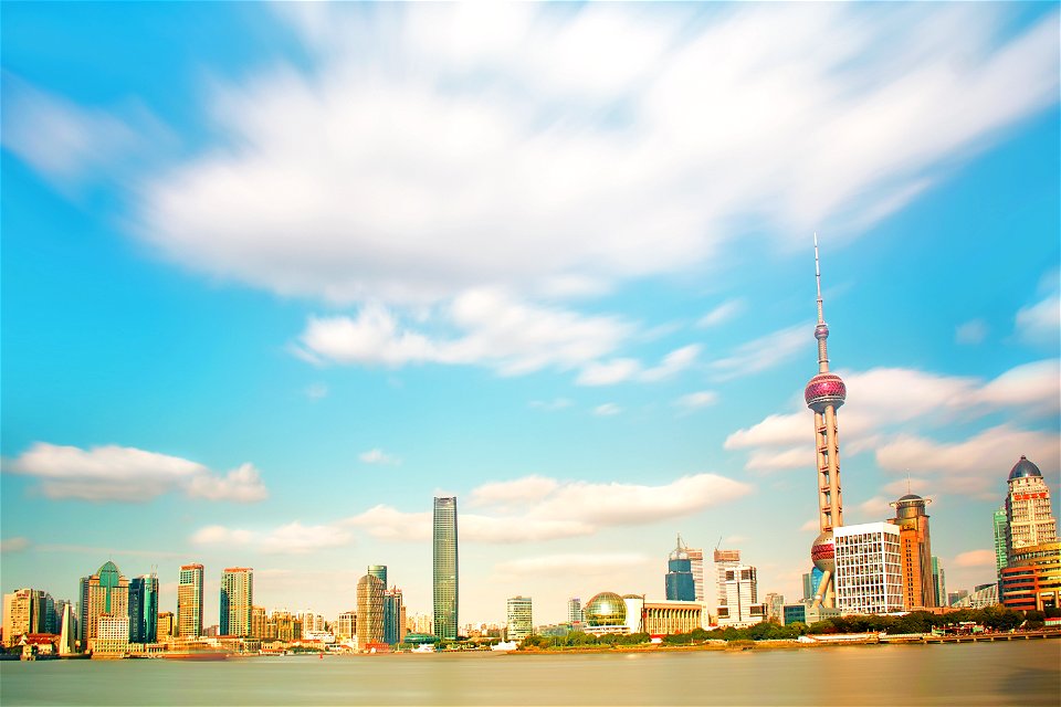 Pearl Tower Near Body Of Water Under Clouds Photo Taken