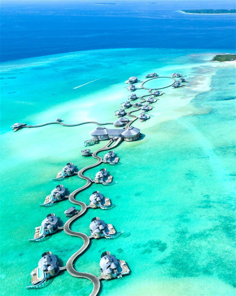 Aerial Photography Of Island With Cottages Surrounded With Water photo