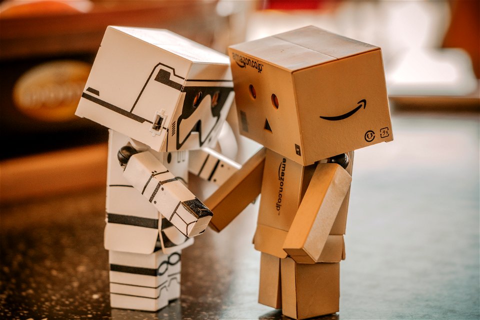 Photo Of White And Brown Cardboard Box Toy Figure