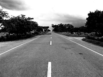 Grayscale Photography Of Concrete Road During Daytime photo