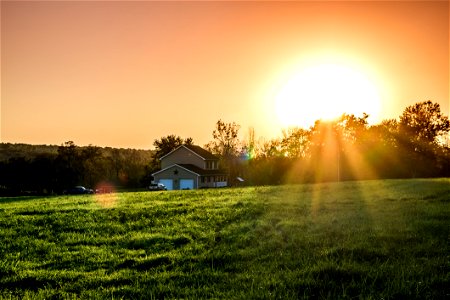 Green Field And Brown And White House During Sunrise photo