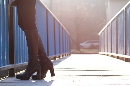 Woman Standing On Bridge photo
