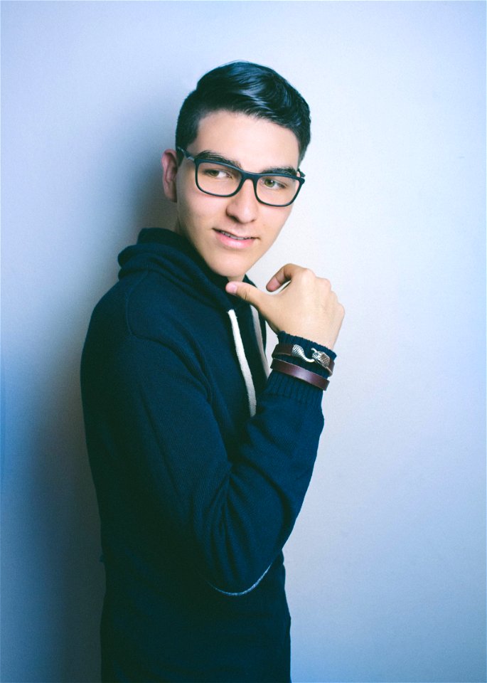 Man In Blue Hooded Jacket And Black Framed Eyeglasses