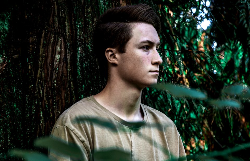 Man Wearing Brown Shirt Near Tree photo