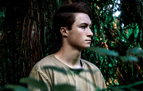 Man Wearing Brown Shirt Near Tree