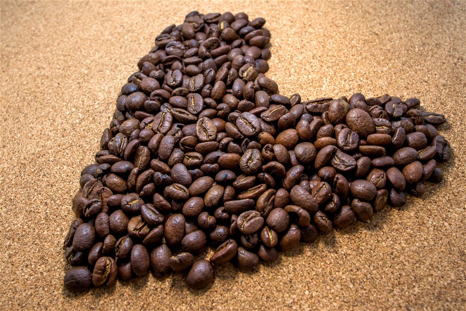 Brown Coffee Bean In Heart Shaped photo