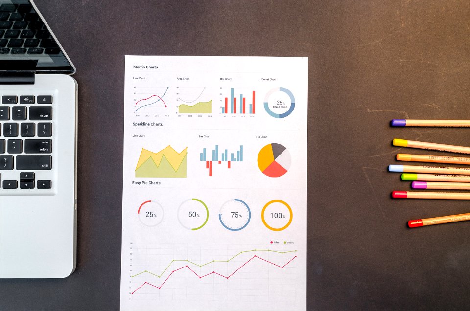Charts On Black Wooden Table