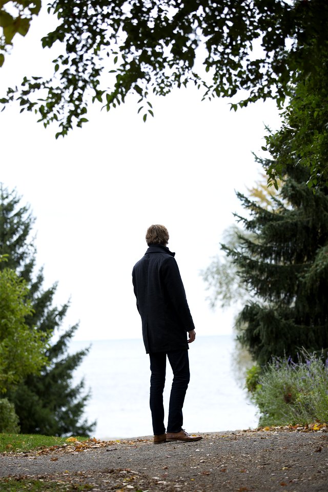 Man Standing In The Middle Of Empty Road photo