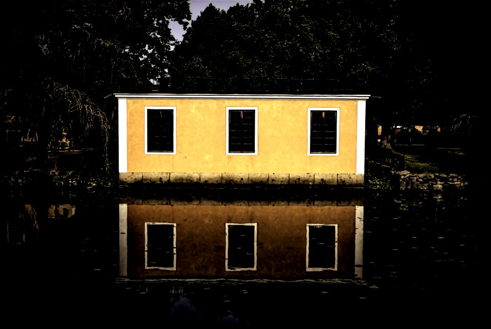 Beige And White House Beside Body Of Water