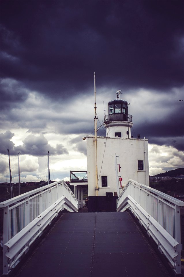 View Of Cloudy Skies On Lighthouse photo