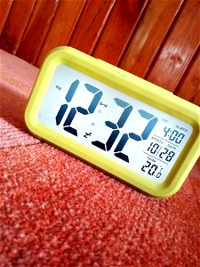 Close-Up Photography Of Yellow Alarm Clock photo