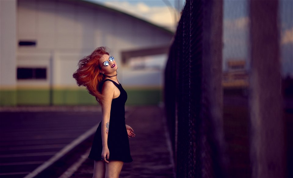 Shallow Focus Photo Of Woman In Black Dress photo