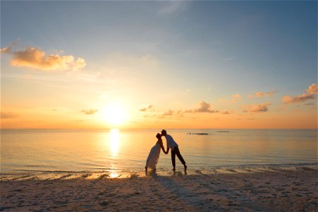 Man And Woman Standing On Shore Kissing photo
