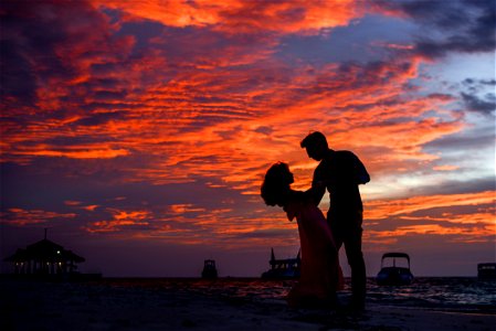 Man And Woman On Beach During Sunset photo