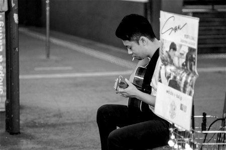 Man Playing Acoustic Guitar Grayscale Photography photo