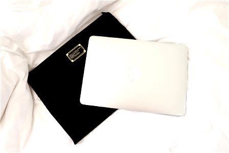 Silver Macbook On Black Case photo