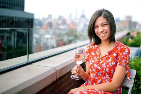 Photo Of A Woman Sitting On Chair Holding Wine Glass photo