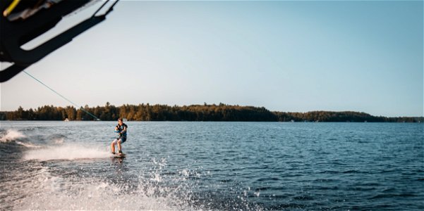 Man Holding Parachute With Wakeboard photo