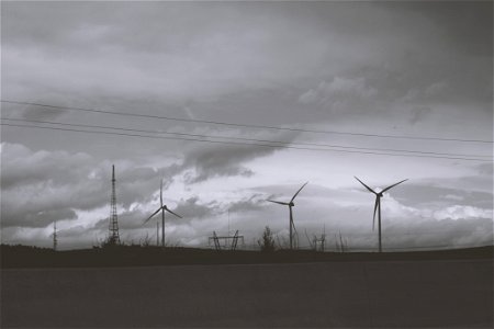 Three Wind Mills Under Cloudy Sky photo