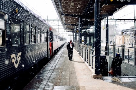 Man Walks Beside Train photo