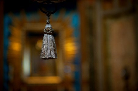 Selective Focus Photograph Of Gray Tassel Accessory photo