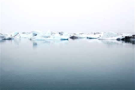 Landscape Photography Of Body Of Water Near Ice Berg photo