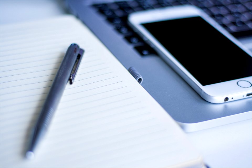 Gray Click Pen On White Notebook Beside Silver Iphone 6
