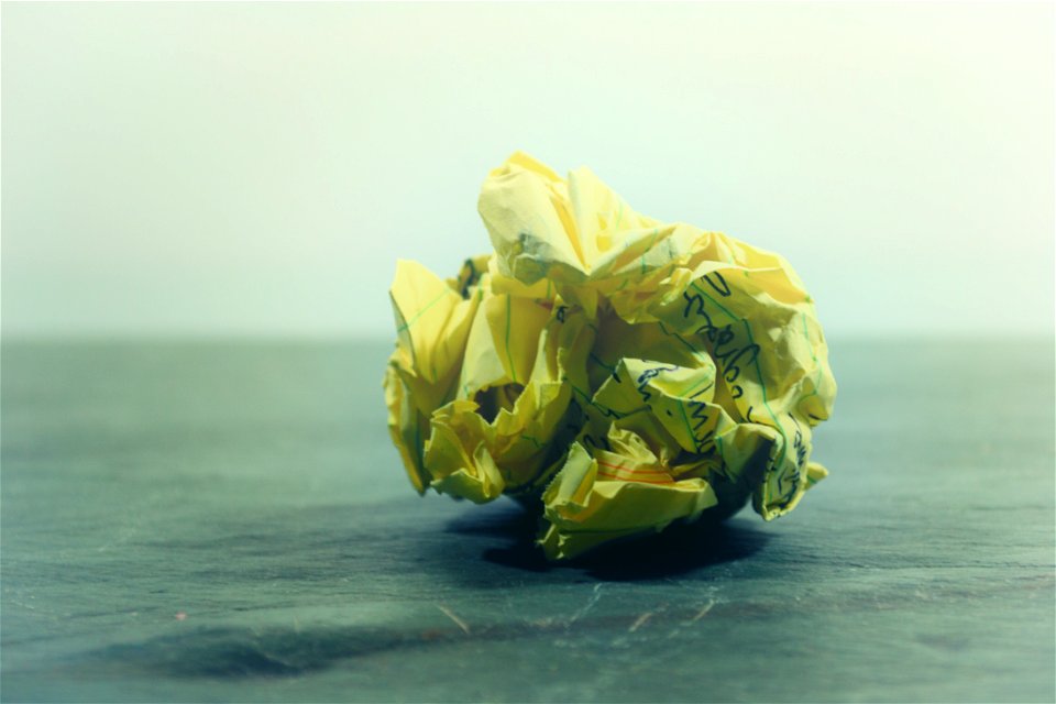 Crumpled Paper On Gray Surface