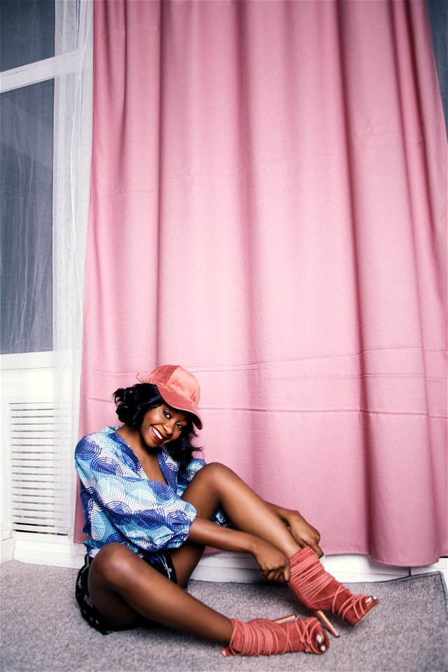 Woman In Blue Scoop-neck Blouse Near Pink Curtain