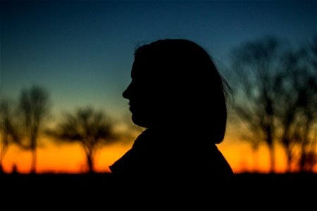 Silhouette Of A Person During Sunset photo